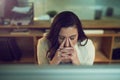 Shes so close to her breaking point. a stressed out businesswoman working late in an office. Royalty Free Stock Photo