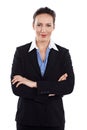 Shes the consumate professional. Cropped portrait of a businesswoman standing with her arms folded against a white