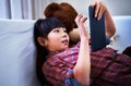 Shes curious about the world online. a little girl using a digital tablet at home.