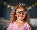 Shes a cutie. Portrait of an adorable little girl playing dress-up at home. Royalty Free Stock Photo
