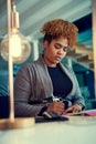 Shes a diligent and focused worker. a young businesswoman working late in an office.