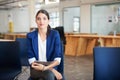 Shes a go getter. A young businesswoman sitting in an office holding paperwork.