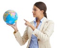 Shes got the businessworld in her hands. an attractive young businesswoman pointing to a globe. Royalty Free Stock Photo