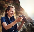 Shes got some great shots. a young woman taking photos with her camera outdoors. Royalty Free Stock Photo