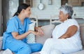 Shes great conversation. Cropped portrait of an attractive senior woman and her female nurse in the old age home.