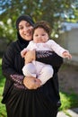 Shes a handful of joy. a muslim mother and her little baby girl.