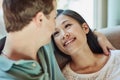 Shes head over heels. a happy young couple relaxing on their couch at home. Royalty Free Stock Photo