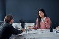 Shes loving the new designs. two young architects going over designs on a laptop together in their office. Royalty Free Stock Photo