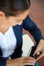 Shes a modern businesswoman. a young businesswoman looking in her briefcase. Royalty Free Stock Photo