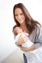 Shes my bundle of joy. Portrait of a young mother holding her newborn daughter at home. Royalty Free Stock Photo