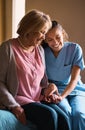 Shes not just here for her medical needs. a female nurse chatting to her senior patient.