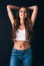 Shes one drop-dead stunner. Studio portrait of an attractive young woman posing against a dark background. Royalty Free Stock Photo