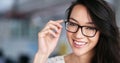 Shes positive about the workday. Portrait of a smiling young professional standing in an office. Royalty Free Stock Photo