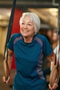 Shes still as sprightly as ever. a senior woman working out in the gym.