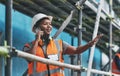 Shes a strong leader and an effective problem-solver. a young woman talking on a cellphone while working at a