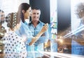 Shes taking the lead on this project. Multiple exposure shot of businesspeople brainstorming with notes on a glass wall Royalty Free Stock Photo