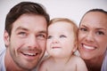 Shes their darling. Two loving young parents and their adorable baby girl. Royalty Free Stock Photo