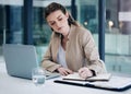 Shes thorough and organised when it comes to business. a young businesswoman writing notes while working on a laptop in Royalty Free Stock Photo