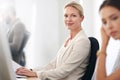 Shes at the top of her game. Portrait of a businesswoman sitting at her office desk.