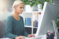 Shes on top of things. Shot of a businesswoman working on her office computer. Royalty Free Stock Photo