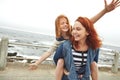 Shes on top of the world. a mother giving her daughter a piggyback ride. Royalty Free Stock Photo