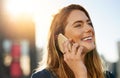 Shes always up for a chat. an attractive young woman making a phone call while standing outside. Royalty Free Stock Photo