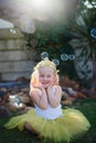 Shes in a world of her own. Full length shot of an adorable little girl playing make believe outdoors. Royalty Free Stock Photo