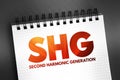 SHG - Second Harmonic Generation acronym text on notepad, abbreviation concept background