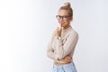 Shhh keep secret. Attractive stylish feminine woman with bun hairstyle glasses cropped top showing shush gesture smiling Royalty Free Stock Photo