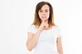 Shhh sign. Young caucasian european woman showing silence in blank white t shirt isolated on white. Copy space Royalty Free Stock Photo