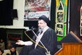 A shia scholar delivering sermon in a Majlis