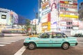 SHIBUYA, JAPAN - FEBRUARY 19, 2016 : green Japan taxi park on t