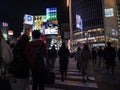 Shibuya, Japan - 7.2.20: Large crowds crossing Shibuya`s famous scramble crossing