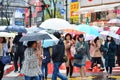 Shibuya, Tokyo, Japan - March 9, 2016 : crossing, crowd people on zebra crosswalk in Hachiko Square, Shibuya on rainy day