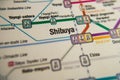 Shibuya Tokyo metro station on a printed metro map under a magnifier lens Royalty Free Stock Photo