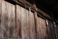 Shide paper hanged on Shimenawa rope around a building