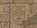 Shield with budded cross carved in stone Royalty Free Stock Photo