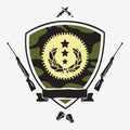 Shield camouflage color with ribbon surrounded by guns, knives,