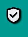Shield with a checkmark on a teal background, symbolizing security. Royalty Free Stock Photo