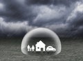 Shield covering home,car and family under rain Royalty Free Stock Photo