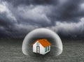 Shield covering home under rain Royalty Free Stock Photo