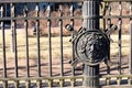 St. Petersburg, Russia, April 2019. Shield with the head of a Roman warrior on an old fence in the city center. Royalty Free Stock Photo