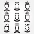 Shields and stylish ribbon set isolated on white background. Collection of different black shield shapes with ribbon, crown and