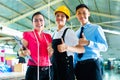 Worker, manager and designer in Chinese factory Royalty Free Stock Photo