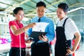 Worker, manager and designer in garment factory Royalty Free Stock Photo