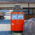 A typical japanese post box with Hikone bronze sculpture on the top