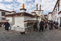 Shigatse, Tibet, China - June 5, 2022: Tibetan pilgrims performing a Kora in Tashilumpo monasterycircumambulation in clockwise
