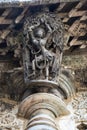 Shilabalika, celestial maiden, as a Dolu Kunita. A lady is palying a drum and dancing . Chennakeshava temple, Belur, Karnataka. No