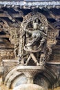 Shilabalika, celestial maiden, as a Kapikupite. Monkey, in the bottom left corner, pulling Saree. Chennakeshava temple, Belur, Kar