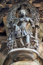 Shilabalika, celestial maiden, in a beauty dance pose. A lady practicing dance steps. Her maids are playing their musical instrume